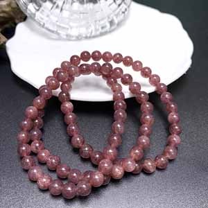 Russian cherry strawberry quartz (6.4mm) multi-wrap, three-wrap wrist.
